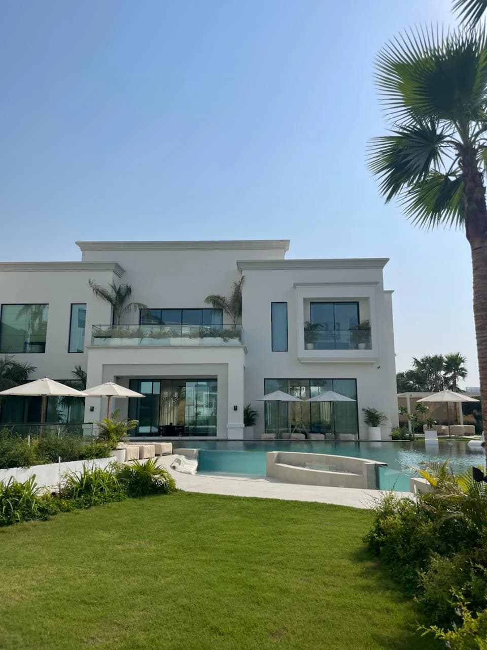 A villa seen across its landscaped garden